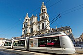 France, Meurthe et Moselle, Nancy, the tram in front of Notre Dame de l'Annonciation de Nancy cathedral on Saint Jean street\n