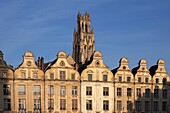 France, Pas de Calais, Bell tower of St Jean Baptiste Church overlooking the typical houses of Heroes Square\n