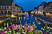 France, Bas Rhin, Strasbourg, old town listed as World Heritage by UNESCO, from the Pont du Corbeau on the Ill river, the Historical museum, Quai des Bateliers, summer evening\n