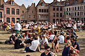 France, Nord, Lille, Vieux-Lille, Comtesse island, jumble sale 2019, walkers sitting in the grass or around tables\n