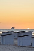 France, Pas de Calais, Calais, beach huts also known cabins at sunset\n