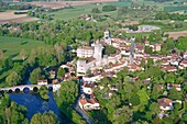 France, Dordogne, Perigord Vert, Bourdeilles, the castle overlooking the village and the Dronne river (aerial view)\n
