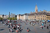 France, Nord, Lille, Place du General De Gaulle or Grand Place, old stock market and belfry of the Chamber of Commerce and Industry in the background\n