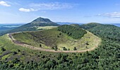 France, Puy de Dome, Orcines, Regional Natural Park of the Auvergne Volcanoes, the Chaîne des Puys, listed as World Heritage by UNESCO, Puy Pariou volcano in the foreground (aerial view)\n