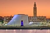 France, Seine-Maritime, Le Havre, city rebuilt by Auguste Perret listed as World Heritage by Unesco, the basin of Commerce, the Volcano by architect Oscar Niemeyer and the bell tower of Saint Joseph's church\n