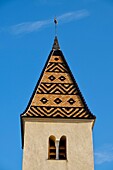 France, Cote d'Or, Fixin, Saint Antoine de Fixey church with a bell tower in glazed tile of burgundy\n