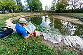 France, Lot, funtain and washing of Oustriols, area called butterfly washing in village of Laburgade\n