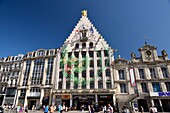 France, Nord, Lille, Place du General De Gaulle or Grand Place, façade of the Voix du Nord building with a drawing as part of the Lille 3000 Eldorado exhibition next to the Theater of the Nord\n