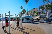 France, Alpes-Maritimes , Cannes, Suquet district ,sportsmen along the beach\n