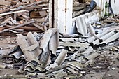 France, Vienne, Chatellerault, demolition site with an asbestos issue, piles of broken corrugated sheets made of asbestos cement\n