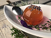 Raindrop dessert: tea jelly with lavender flowers, thyme and lavender syrup