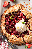 Shortbread Strawberry and Rhubarb Galette with Almond Petals and Vanilla Ice Cream