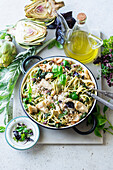 Artichoke pasta with white beans, pesto and pine nuts