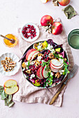 Autumn apple salad with pomegranate and walnuts