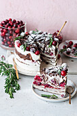 Cranberry crepe cake with whipped cream and rosemary