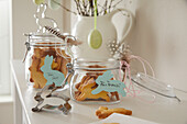 Easter biscuits in preserving jars with bunny cookie cutters and decoration