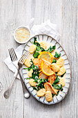 Gnocchi with roast chicken breast, spinach and lemon