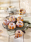 Mini yogurt bundt cakes with blueberries and icing