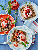 Poppy seed waffles with strawberry and cassis salad
