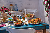 Greek buffet with orzo salad, gyros chicken, tzatziki, semolina cake