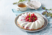 Vanilla ice cream cake with raspberries
