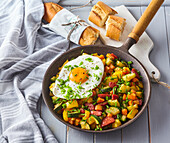 Vegetable and sausage skillet with fried egg