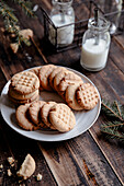 Peanut butter cookies on a white plate in rustic style