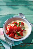 Marinated gin strawberries with vanilla sauce