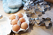 Eggs in a carton and cookie cutters