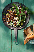 Crispy minced lamb skillet with avocado and feta