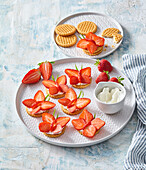 Strawberry butterflies on biscuits