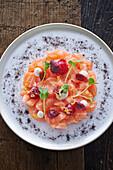 Salmon tartare with cranberries and cheese