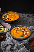 Pumpkin soup with apple and buckwheat topping