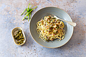 Spaghetti with almonds, capers and sardines