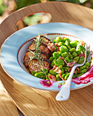 Pork fillet with broad beans and bacon
