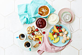 Amaretti and biscotti with fruit, sweet dips and coffee