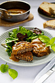 Vegan bean patties with sauce and salad