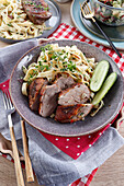 Roast duck breast with pasta and cucumber