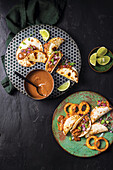 Roasted pulled pork tortillas with mole negro (Mexican black sauce)