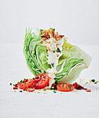 BLT iceberg salad with tomatoes, bacon and croutons