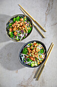 Vegan Asian glass noodle salad with tofu, sprouts and peanuts
