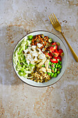 Edamame bowl with brown lentils and millet