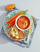 Vegan lentil spread in bowl and potato spread with omega 3 on bread