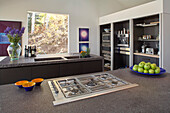 Two kitchen islands with gas stove and sinks in front of a cupboard with kitchen appliances