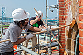 Workers repairing tower