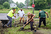 Volunteers clearing ground for roadside garden