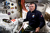 Danish astronaut Andreas Mogensen working on spacesuit