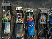 Fishermen sleeping in their boats, Bangladesh