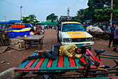 Homeless man sleeping in street, Dhaka, Bangladesh