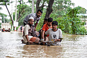 People travelling through floodwater, Satkania Upazila, Bangladesh